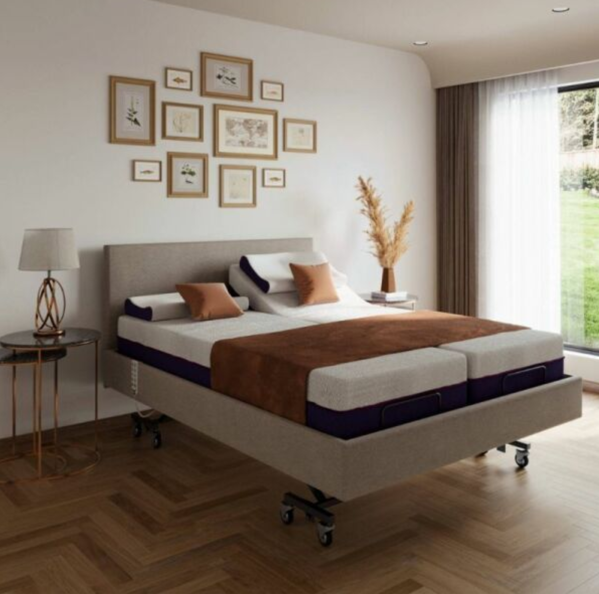 A high-end adjustable platform bed with a light beige upholstered frame and black caster wheels, styled in a modern bedroom with a herringbone wood floor, wall art, and a window with sheer curtains.