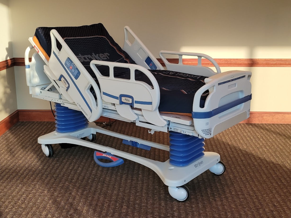 StrykerSecure3 Hospital bed with adjustable features in a room setting